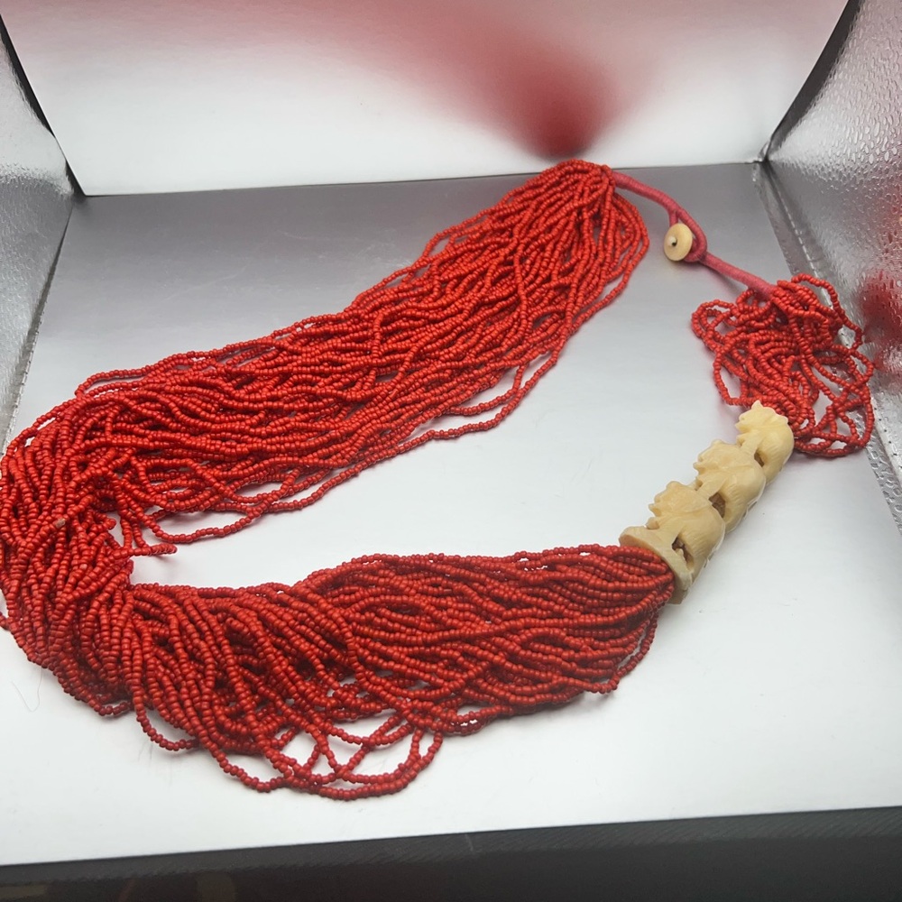 Elegant Red Beaded Necklace with Ivory-look Elephant decoration
